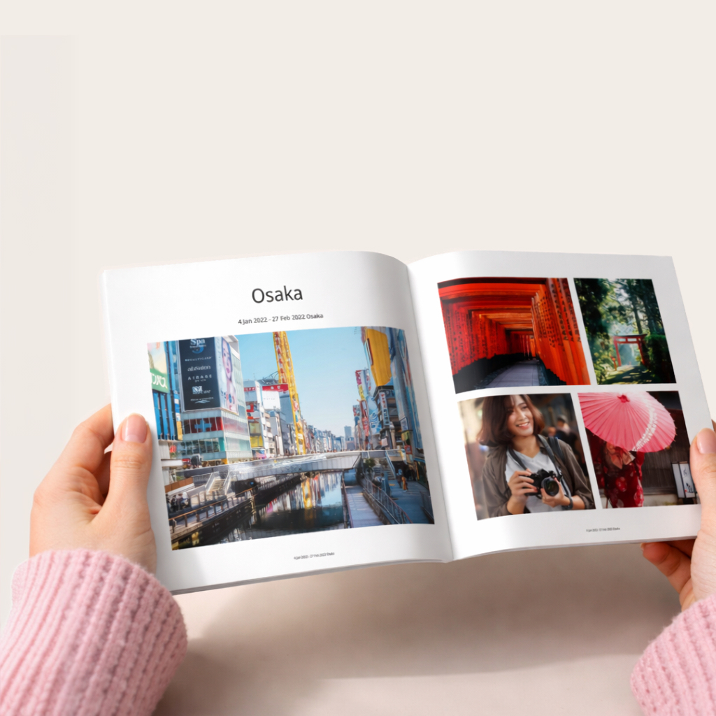 An open Lumashot photo book being held in both hands
